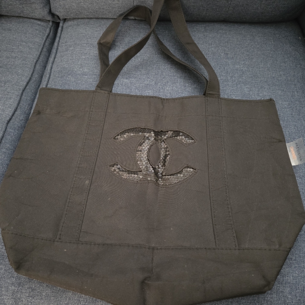 CHANEL Black Canvas Tote with Embellished Logo
